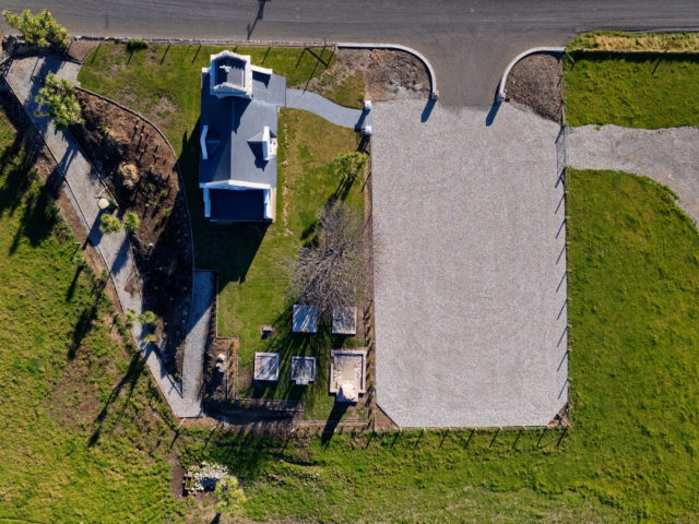 St Oswald Church Aerial view of historic Saint Oswald's Memorial Church and grounds, surrounded by green fields, ideal for heritage wedding ceremonies and events.