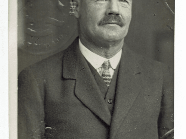Historic portrait of distinguished gentleman in formal attire at Saint Oswald's Memorial Church heritage wedding venue