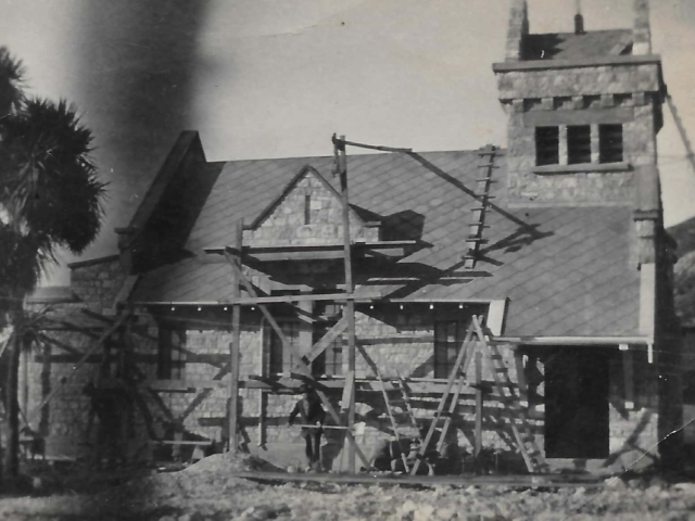 Saint Oswald's Memorial Church under renovation showing historic stone chapel with tower and scaffolding, heritage architecture ready for ceremonies.